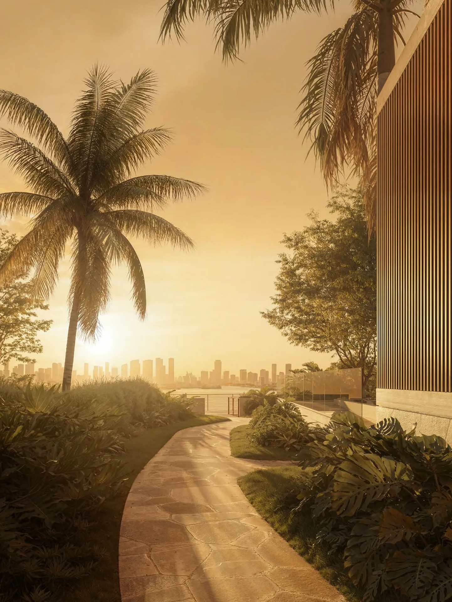 1250 West Avenue Miami Beach – golden-hour garden path toward the bay and skyline